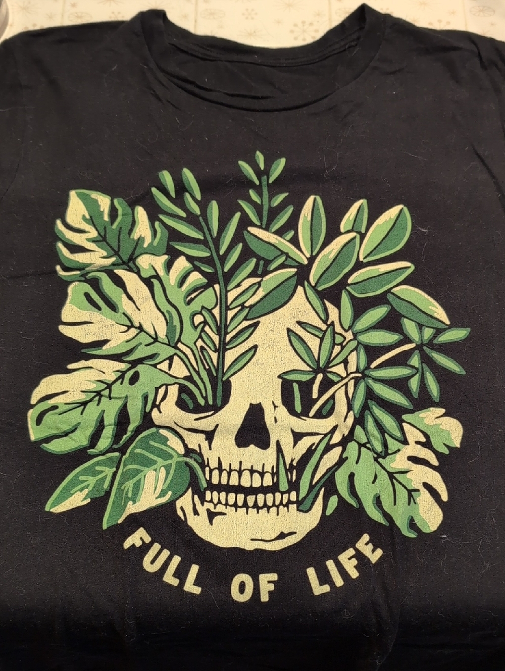 Wicked Women's Black Graphic Tee with Green Leaf Skull Design